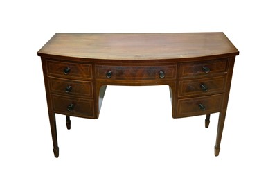 Lot 123 - A LATE VICTORIAN MAHOGANY BOW FRONT KNEEHOLE DRESSING TABLE