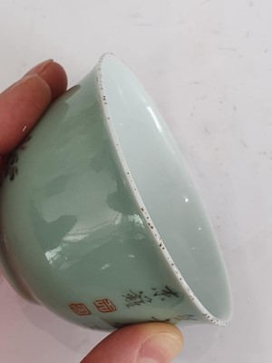 Lot 676 - A CHINESE FAMILLE ROSE CELADON-GROUND BOWL.