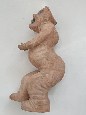 Lot 305 - A LARGE CHINESE POTTERY FIGURE OF A JESTER.