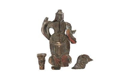Lot 406 - AN EARLY CHINESE POLYCHROME WOOD FIGURE OF A GUARDIAN.