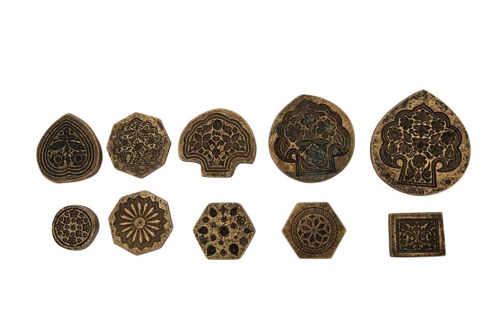 Lot 488 - TEN BRASS DECORATIVE MOULDS FOR TOOLING LEATHER COVERS