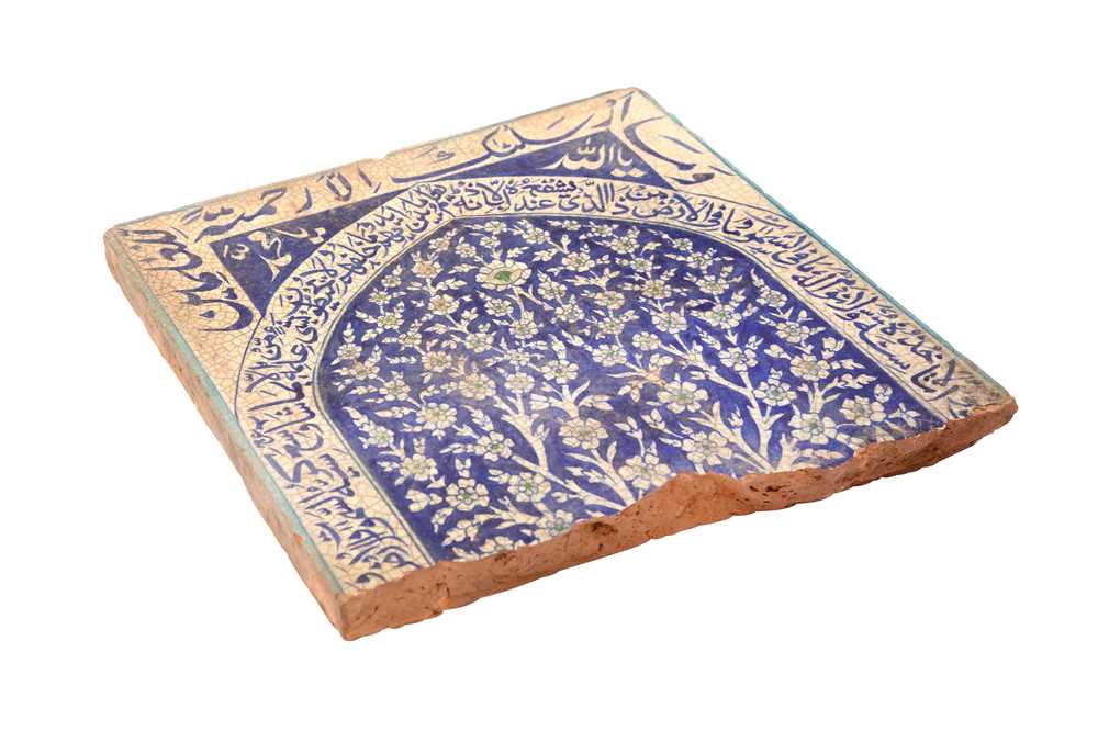 Lot 451 - A MULTAN POTTERY TILE WITH A DENSELY