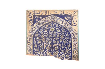 Lot 451 - A MULTAN POTTERY TILE WITH A DENSELY INSCRIBED MIHRAB