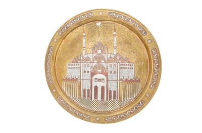 Lot 570 - A SILVER AND COPPER-OVERLAID BRASS DISH FEATURING THE BLUE MOSQUE