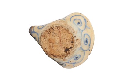 Lot 388 - A SAFAVID BLUE AND WHITE POTTERY OIL LAMP