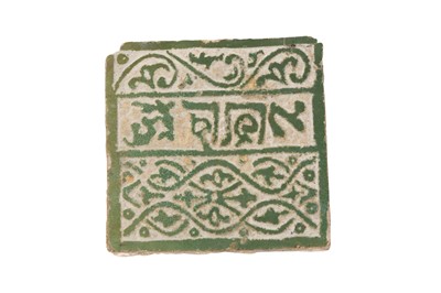 Lot 464 - A FRAGMENT OF A GREEN-GLAZED MARINID TERRACOTTA TILE