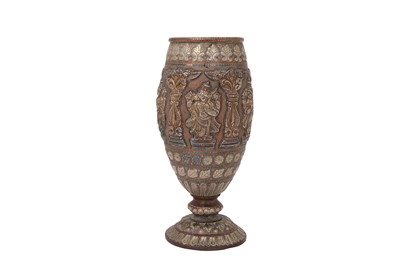 Lot 571 - A TANJORE SILVER-OVERLAID COPPER VASE