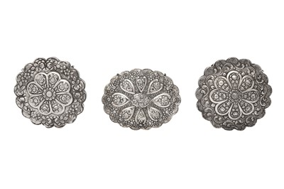 Lot 568 - THREE TURKISH REPOUSSÉ SILVER-FOILED HANGING MIRRORS