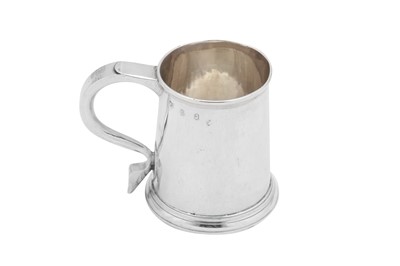 Lot 511 - A Queen Anne Britannia standard silver half pint mug, London 1710 by Thomas Parr