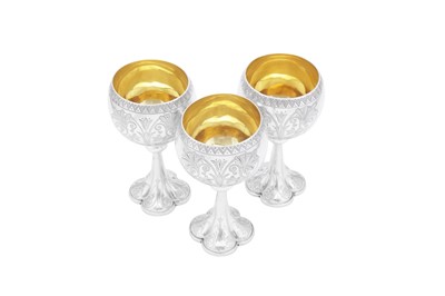 Lot 421 - A set of three Victorian sterling silver wine goblets, Birmingham 1875-76 by Elkington and Co