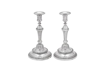 Lot 208 - A pair of Louis XVI late 18th century French provincial silver candlesticks, Lille 1784 by Louis-François-Joseph Devaucenne (1752-1832, master 1778)