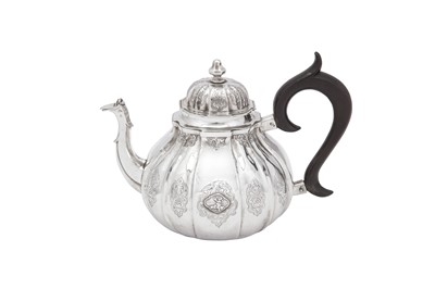 Lot 243 - An early 18th century German silver teapot, Augsburg 1734 by Esaias Busch III (master 1704, d. 1759)