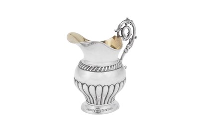 Lot 239 - An early 19th century German silver milk jug, Brunswick circa 1830 by Johann Friedrich Boden (active 1820-48)