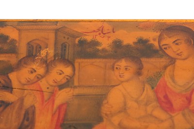 Lot 50 - A LACQUERED PAPIER-MÂCHÉ PEN CASE (QALAMDAN) WITH THE VIRGIN MARY AND CHILD