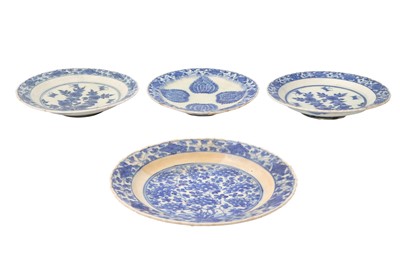 Lot 30 - FOUR BLUE AND WHITE CHINESE-INSPIRED POTTERY DISHES