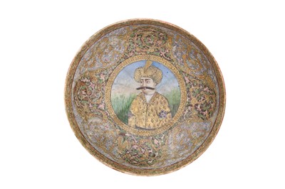 Lot 18 - A POLYCHROME-ENAMELLED AND GILT POTTERY BOWL WITH A PORTRAIT OF SHAH ABBAS I
