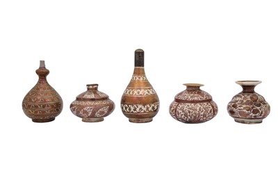 Lot 29 - A COLLECTION OF FIVE SAFAVID COPPER LUSTRE-PAINTED POTTERY BOTTLES AND VASES