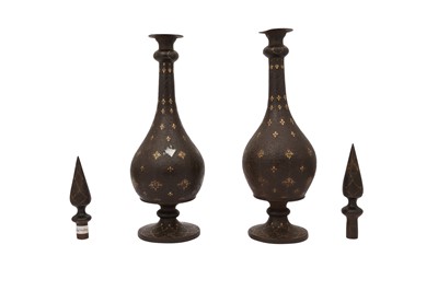 Lot 28 - A NEAR PAIR OF QAJAR GOLD-DAMASCENED STEEL BOTTLES WITH STOPPERS