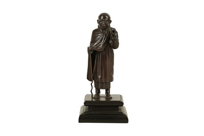 Lot 579 - A BRONZE FIGURE OF A MONK,  20TH CENTURY