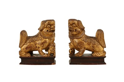 Lot 592 - A PAIR OF CHINESE CARVED GILTWOOD TEMPLE DOGS, LATE 19TH/EARLY 20TH CENTURY