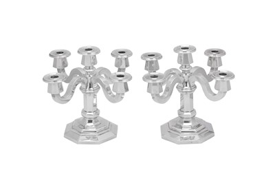 Lot 210 - A pair of early 20th century Belgian Art Deco sterling silver five-light candelabra, circa 1930 possibly by Raymond Ruys