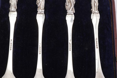 Lot 292 - A cased set of four Victorian sterling silver apostle fruit serving spoons, London 1855 by George Adams of Chawner and Co