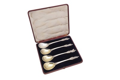 Lot 292 - A cased set of four Victorian sterling silver apostle fruit serving spoons, London 1855 by George Adams of Chawner and Co