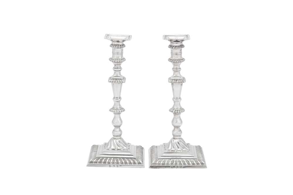 Lot 496 - A large pair of early George III sterling silver candlesticks, London 1764 by John Hyatt (Grimwade 1369)
