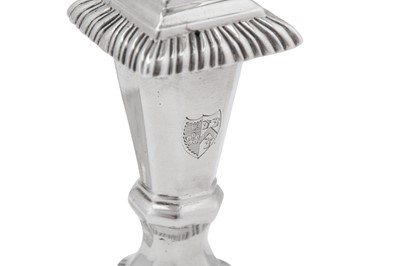 Lot 496 - A large pair of early George III sterling silver candlesticks, London 1764 by John Hyatt (Grimwade 1369)