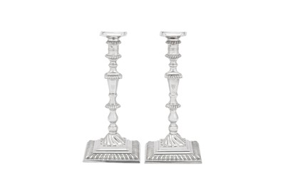 Lot 496 - A large pair of early George III sterling silver candlesticks, London 1764 by John Hyatt (Grimwade 1369)