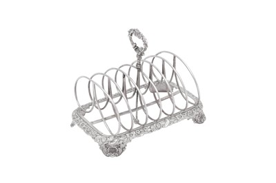 Lot 410 - A George IV sterling silver seven bar toast rack, London 1824 by Joseph Angell I (first reg. 7th Oct 1811, this mark 8th April 1824)