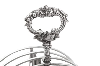 Lot 410 - A George IV sterling silver seven bar toast rack, London 1824 by Joseph Angell I (first reg. 7th Oct 1811, this mark 8th April 1824)