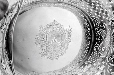 Lot 515 - A George II sterling silver cake basket, London 1740 by John Jacob (reg. 20th June 1739)
