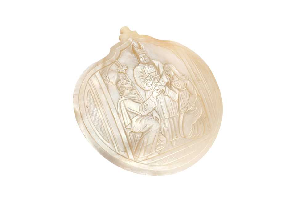 Lot 306 - λ A CARVED MOTHER-OF-PEARL SHELL PLAQUE WITH