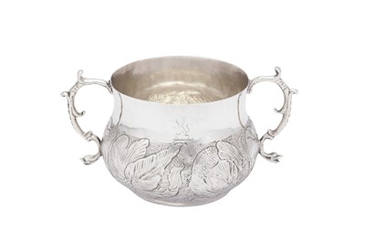 Lot 513 - A Charles II sterling silver twin handled porringer, London 1667 probably by William Mouse the Younger (free 1664, d. c. 1675)