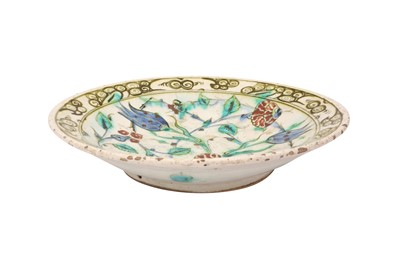 Lot 316 - AN IZNIK POTTERY DISH WITH TULIPS AND CARNATIONS