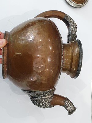 Lot 389 - A TIBETAN COPPER BUTTER-TEA TEAPOT AND COVER.