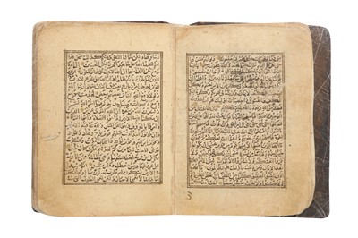 Lot 458 - A SECTION OF A MINIATURE QUR’AN: FROM SURA AL-HUJURAT (49) TO SURA AL-MUZZAMMIL (73)