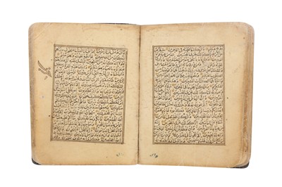 Lot 458 - A SECTION OF A MINIATURE QUR’AN: FROM SURA AL-HUJURAT (49) TO SURA AL-MUZZAMMIL (73)
