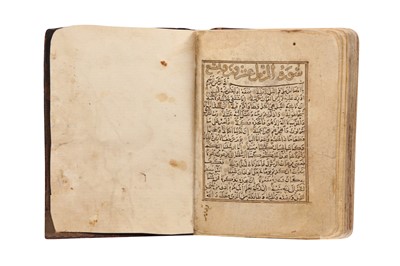 Lot 458 - A SECTION OF A MINIATURE QUR’AN: FROM SURA AL-HUJURAT (49) TO SURA AL-MUZZAMMIL (73)