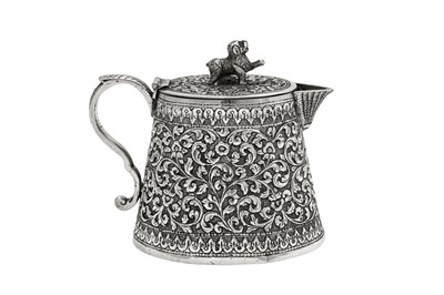 Lot 132 - A late 19th century Anglo – Indian unmarked silver covered milk or cream jug, Cutch circa 1880
