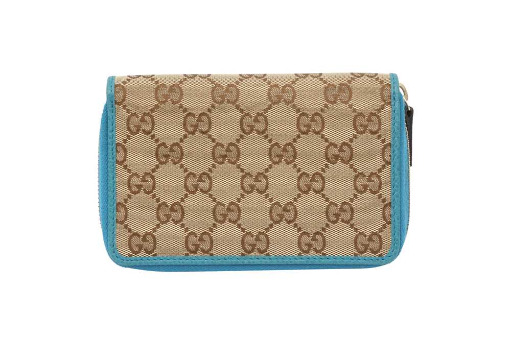 Lot 142 - Gucci Beige GG Monogram Zip Around Wallet