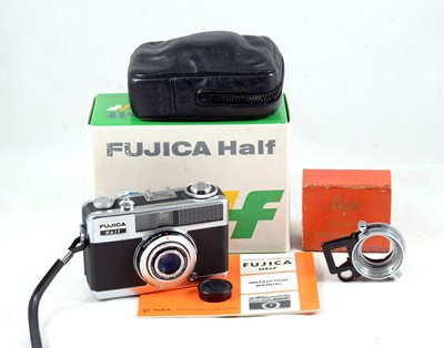 Lot 95 - A Good Fujica Half Frame Compact Camera & a Leitz SOOKY Attachment