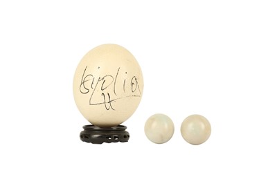 Lot 559 - A BOXED PAIR OF CHINESE XILING JADE EXERCISE BALLS, 20TH CENTURY