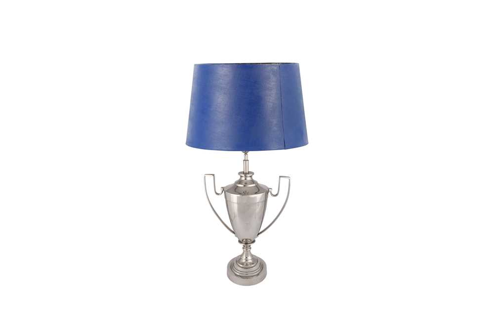 Lot 80 - A LARGE CHROMED TABLE LAMP IN THE FORM OF A TROPHY, CONTEMPORARY