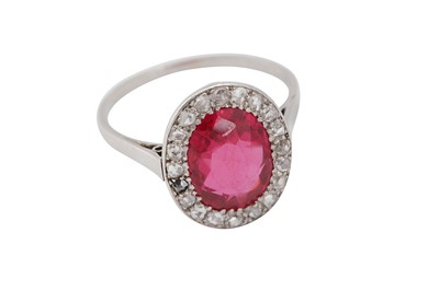 Lot 105 - A synthetic ruby and diamond cluster ring