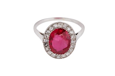 Lot 105 - A synthetic ruby and diamond cluster ring