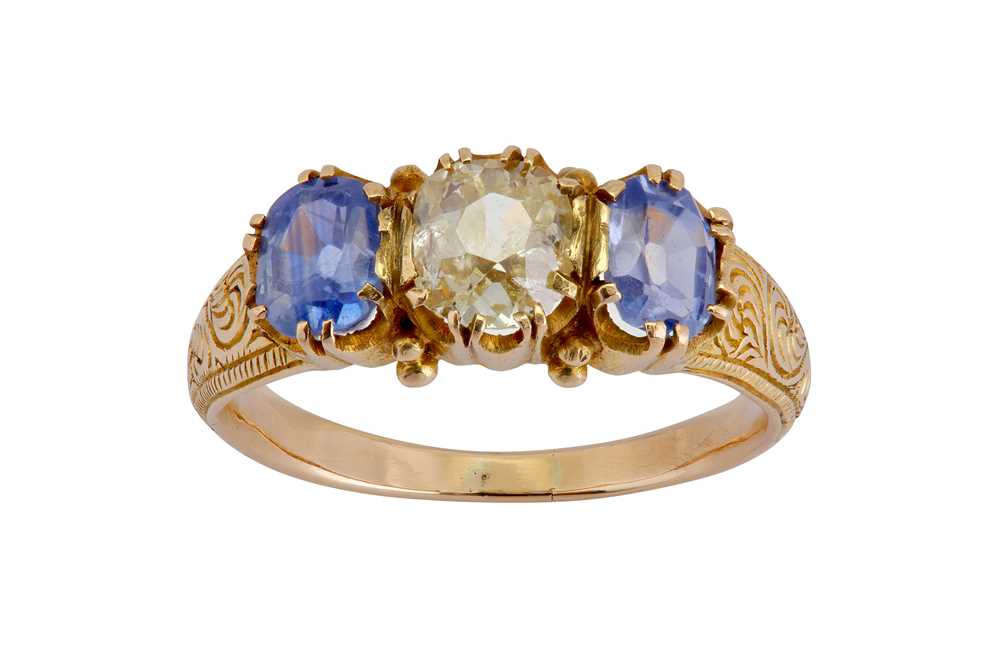 Lot 40 - A sapphire and diamond three-stone ring