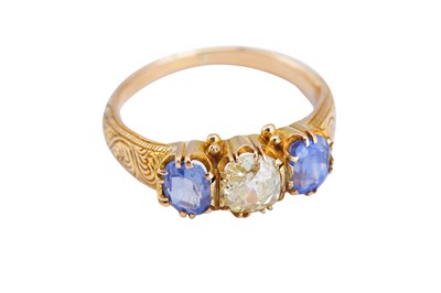 Lot 40 - A sapphire and diamond three-stone ring
