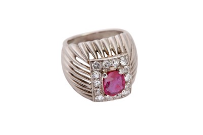 Lot 214 - A ruby and diamond dress ring